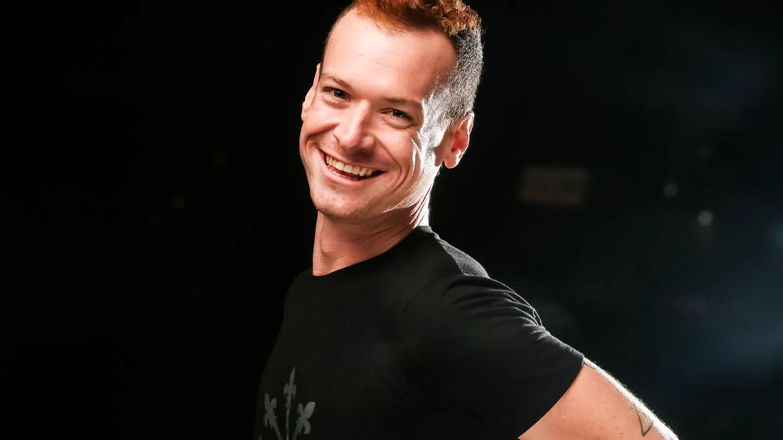 a man smiling at the camera