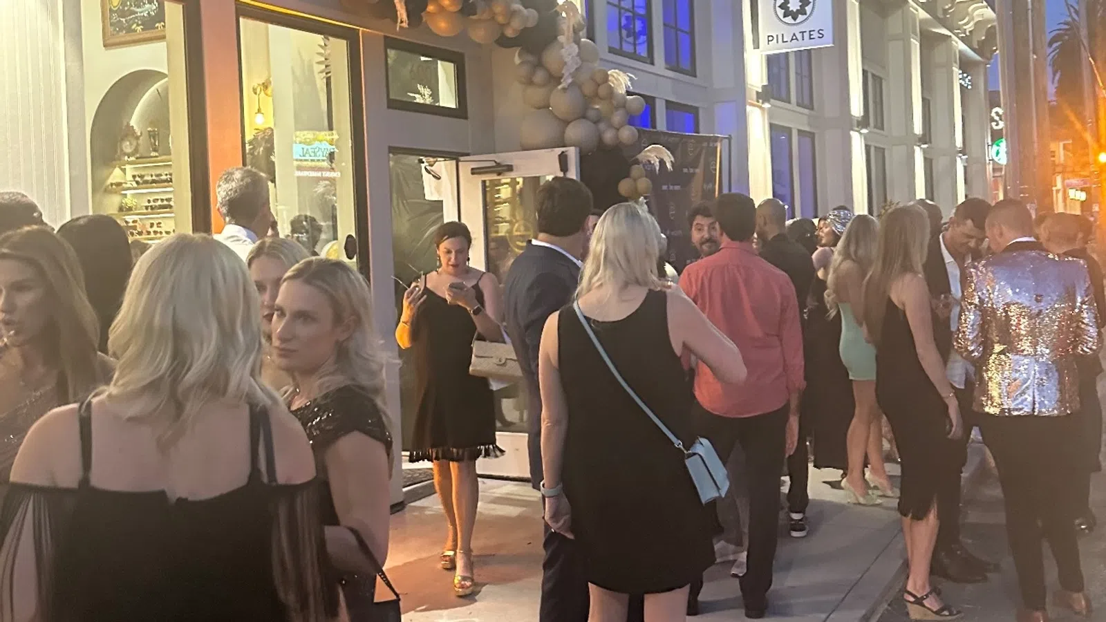 a group of people standing in front of a building