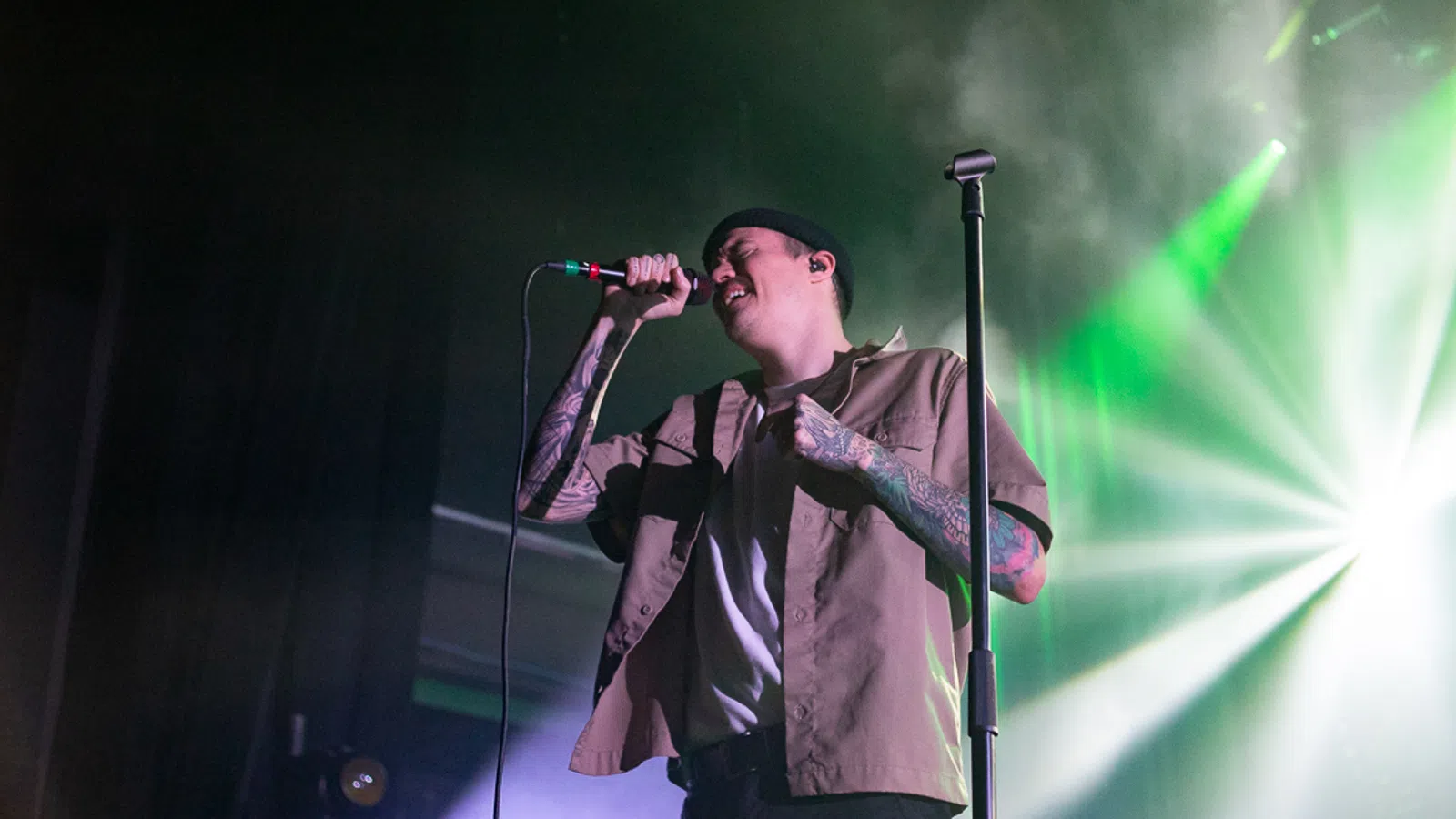 a person singing into a microphone
