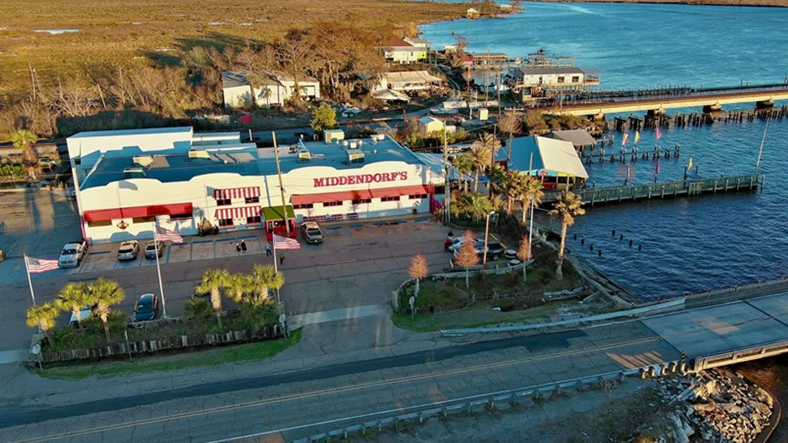 a large stadium with a parking lot