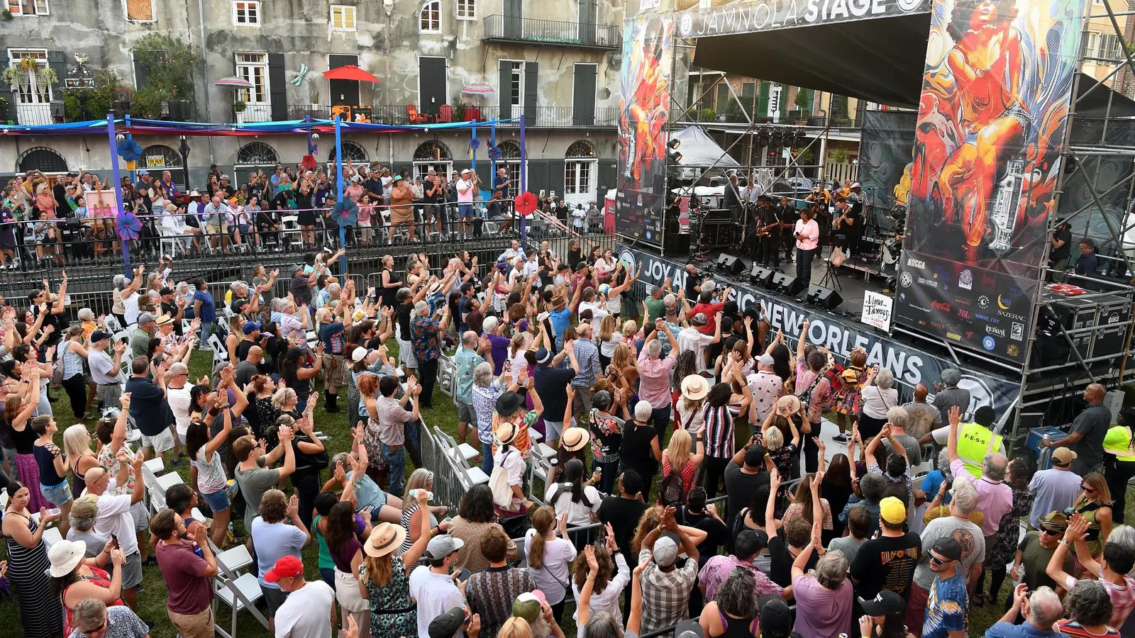 a crowd of people watching a band on stage