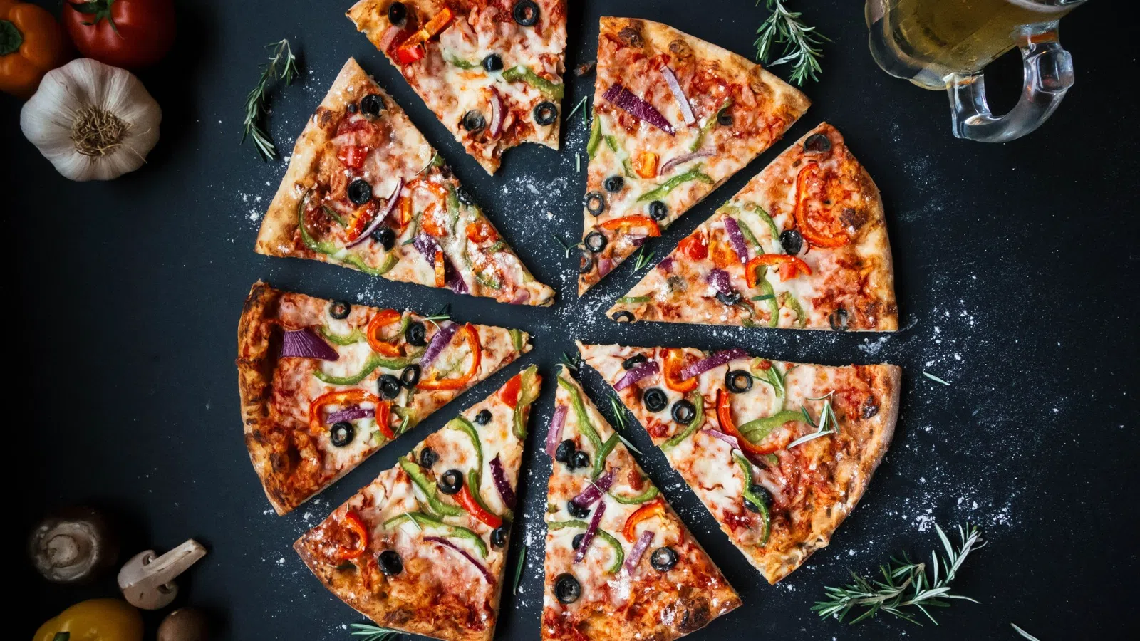 a group of pizzas on a table