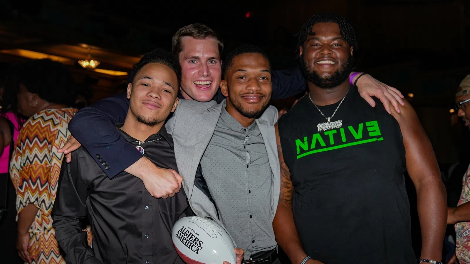 a group of men posing for a picture