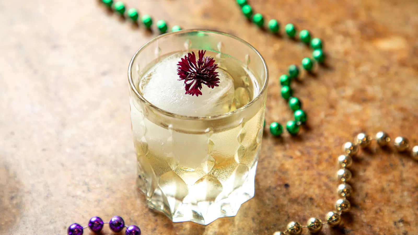 a glass of milk and a necklace