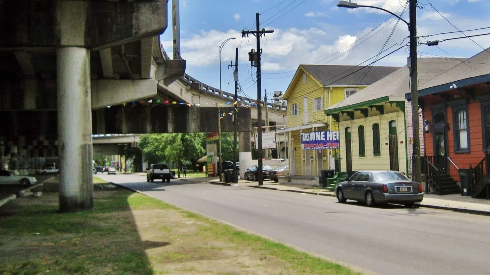 a street with cars and buildings