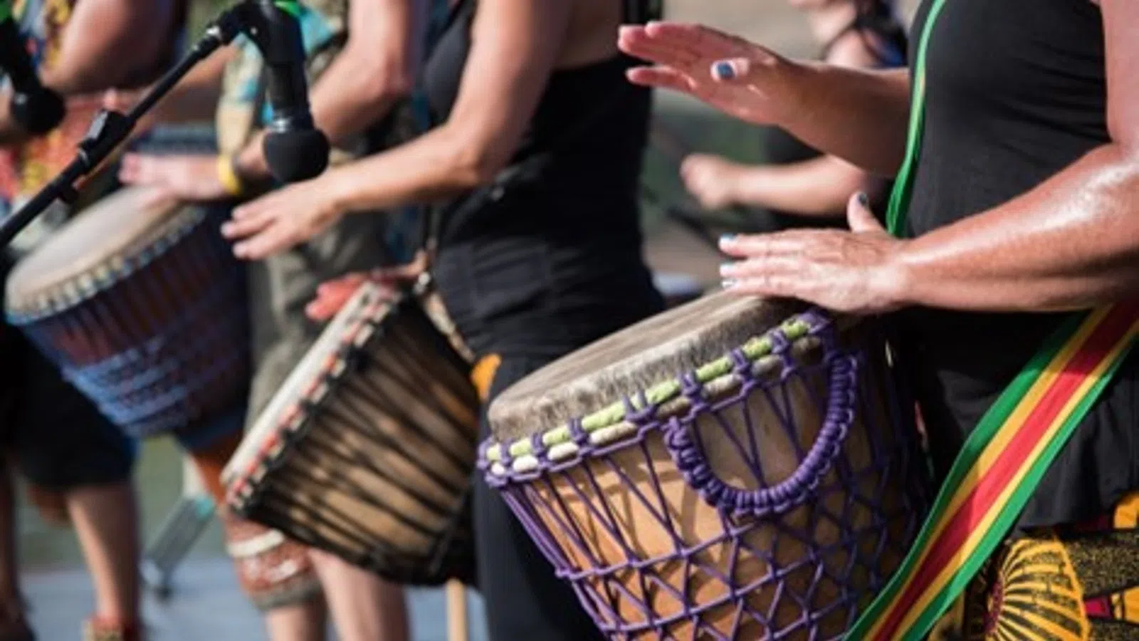 a group of people playing drums