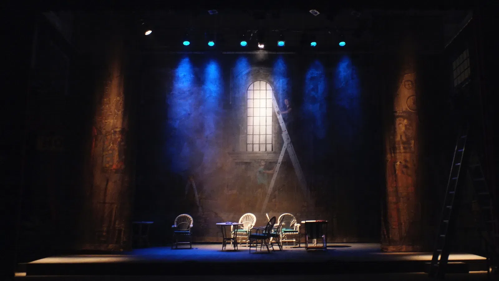 a stage with chairs and tables