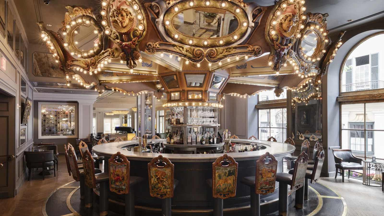 a large room with a large chandelier and chairs