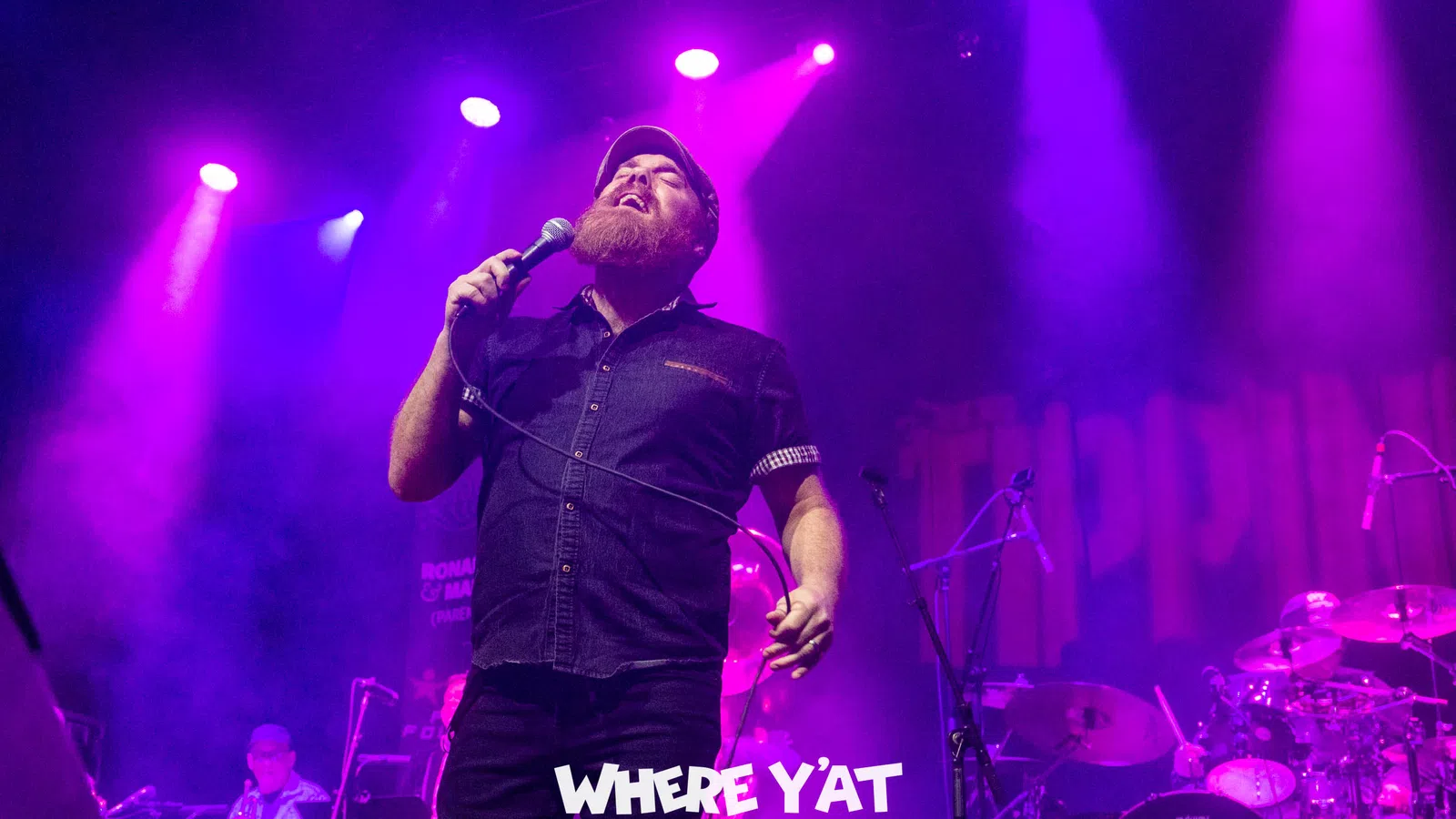 a person singing into a microphone