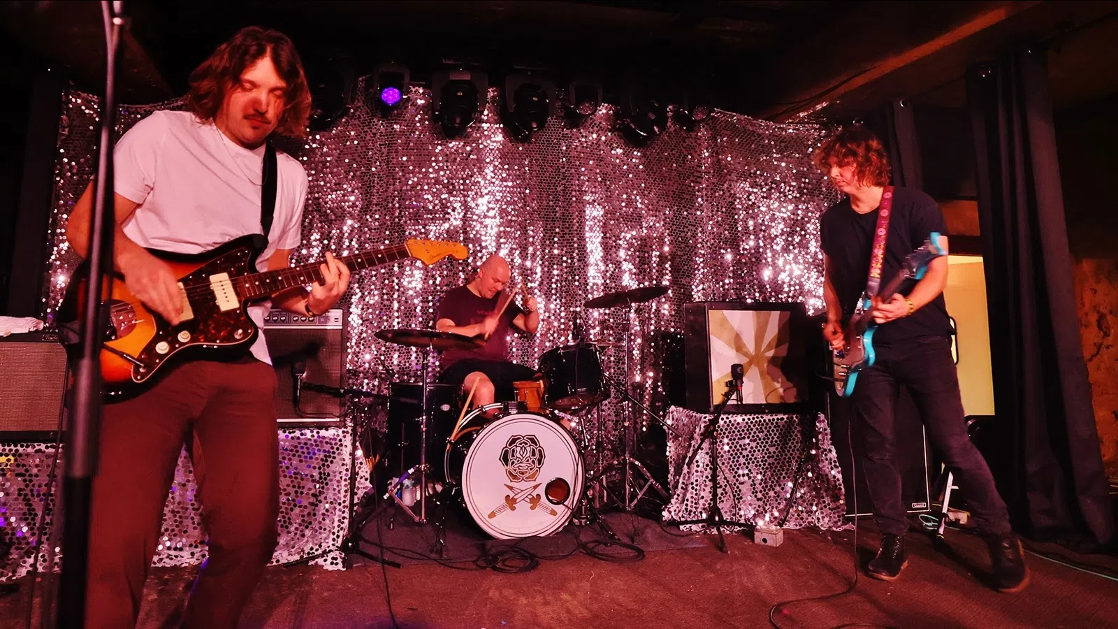 a group of people playing instruments on a stage