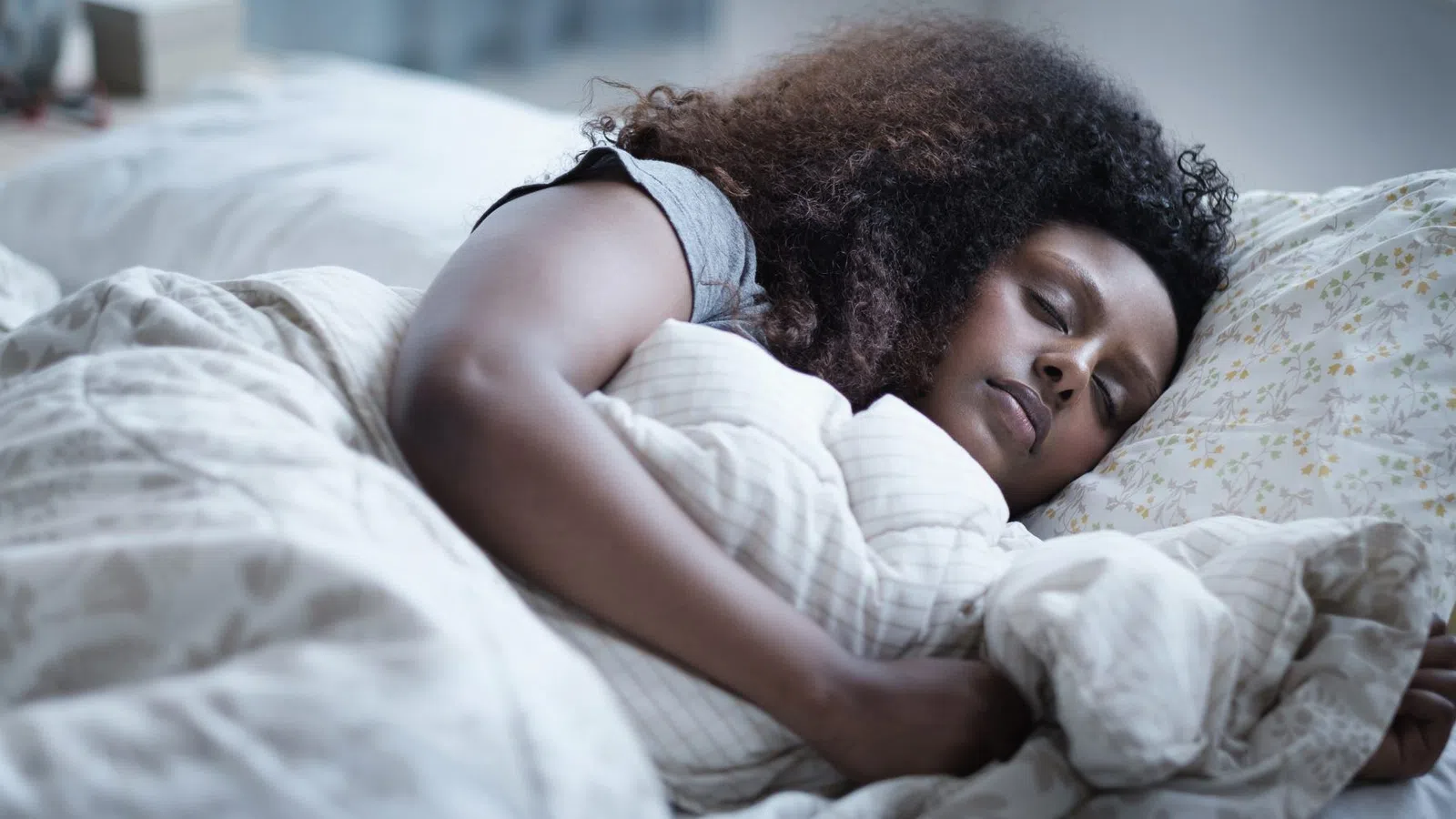 a person lying on a bed