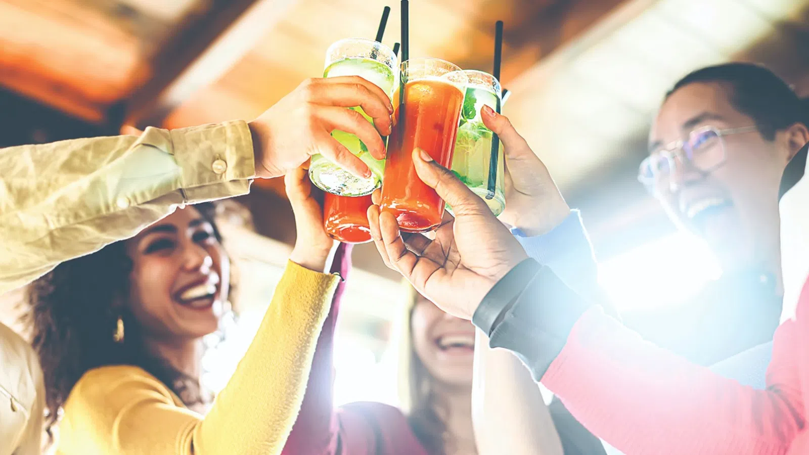 a woman holding a drink