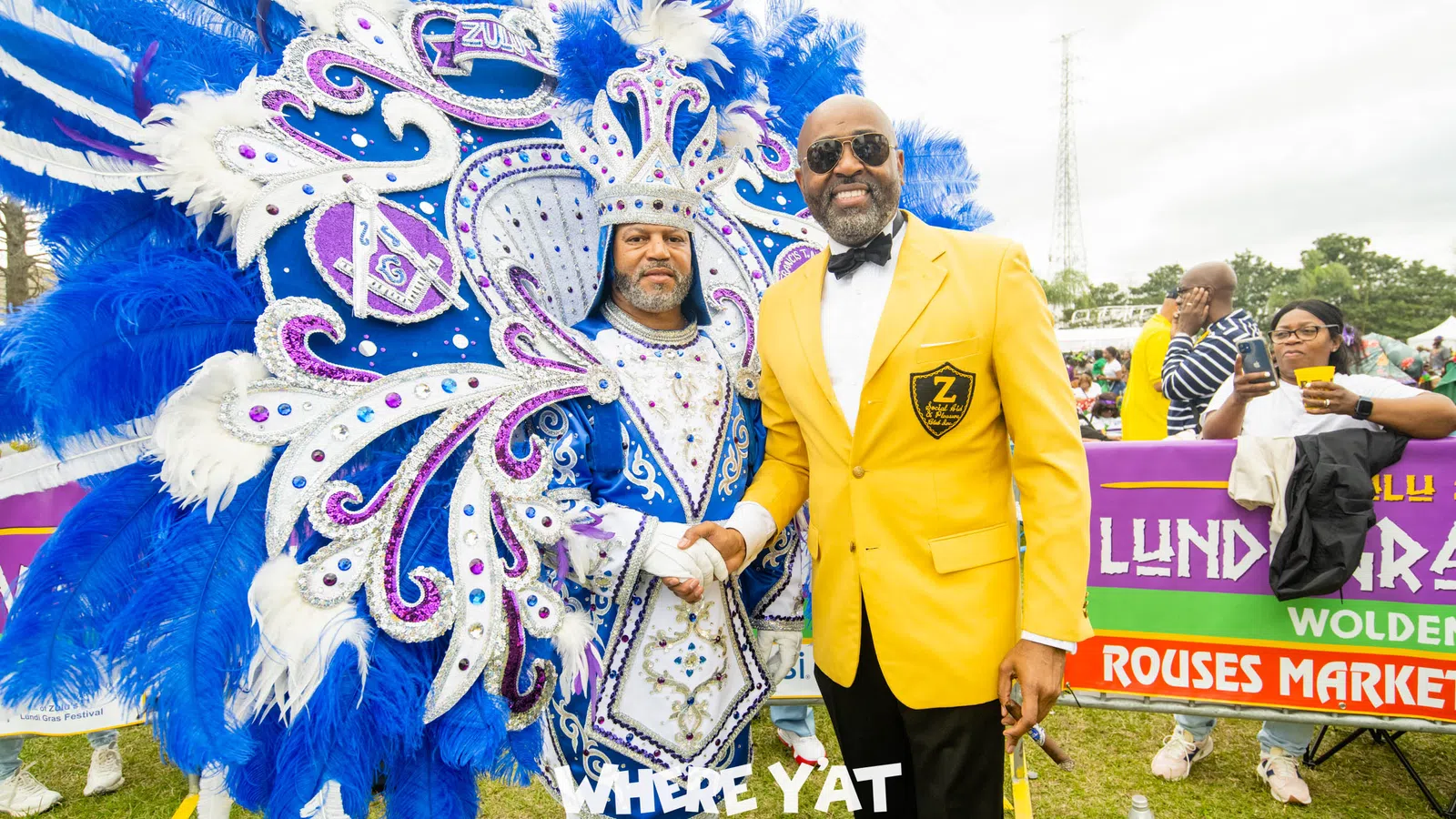a man standing next to a man in a garment