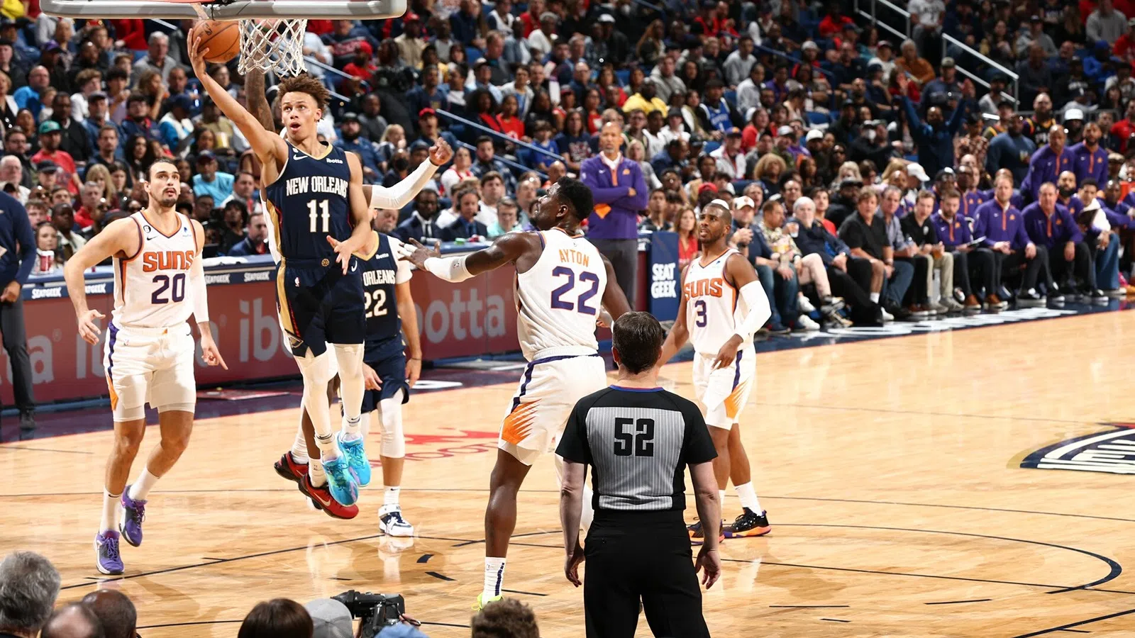 a group of men playing basketball