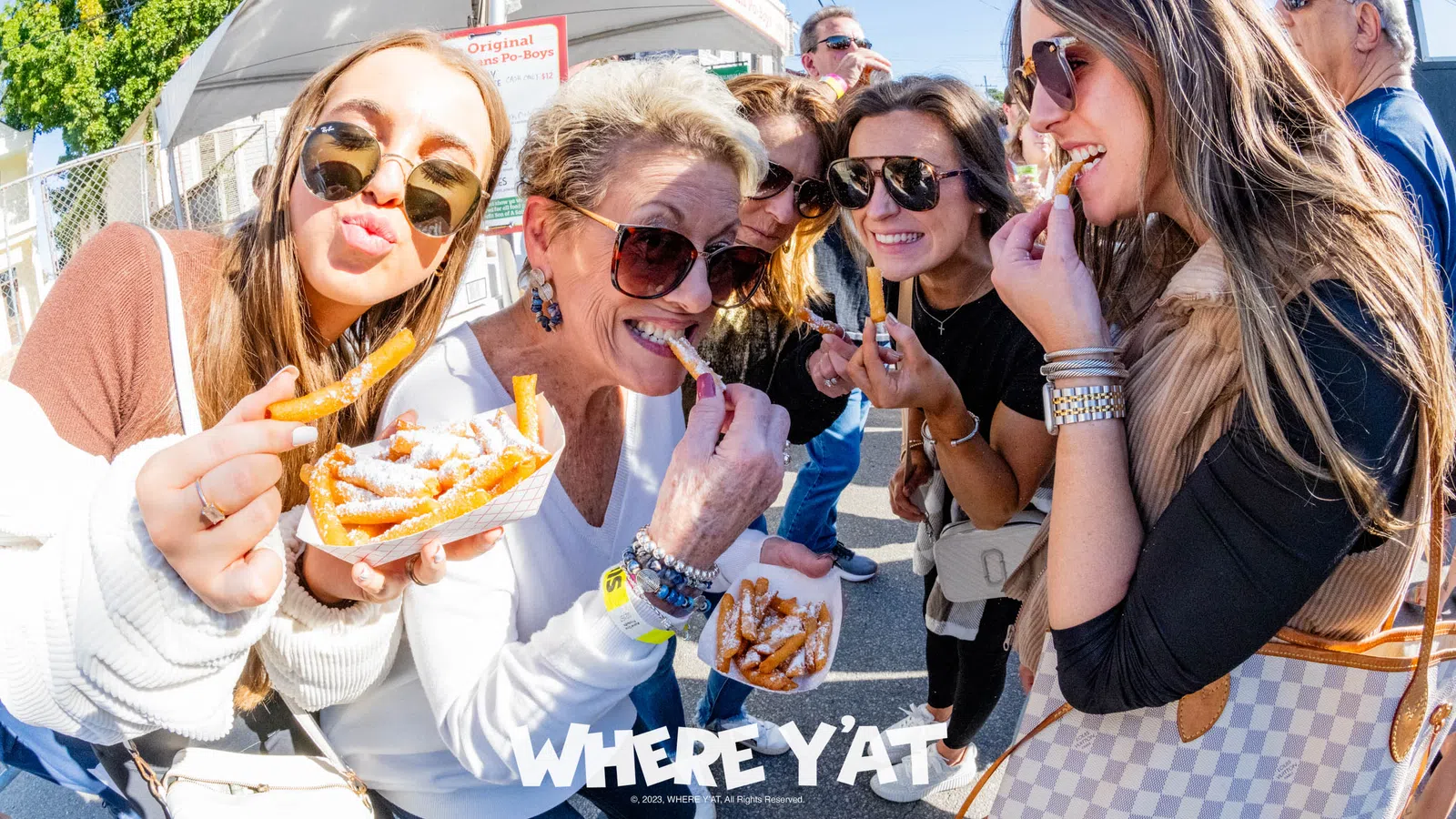a group of women eating pizza