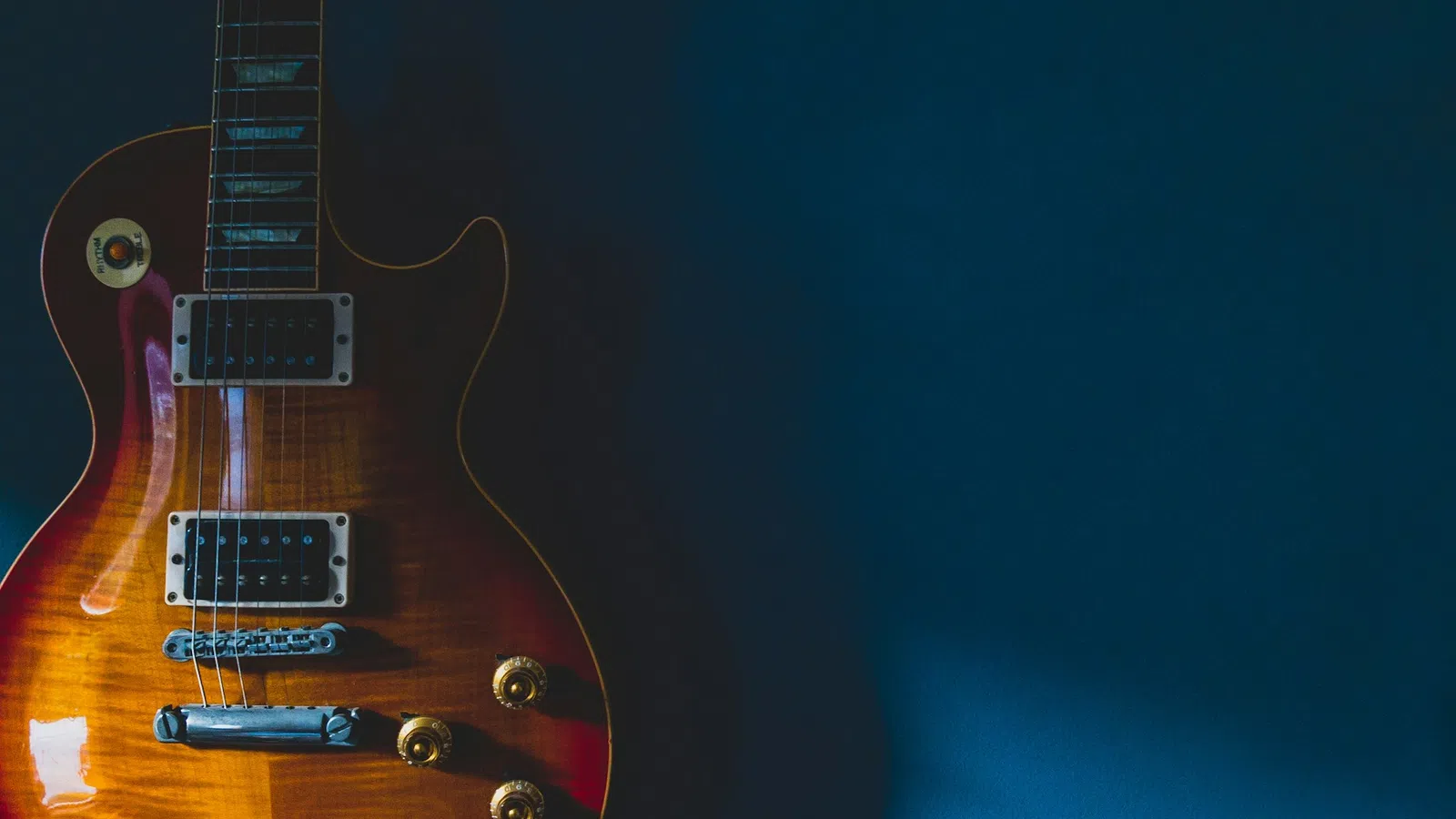 a guitar with a blue background