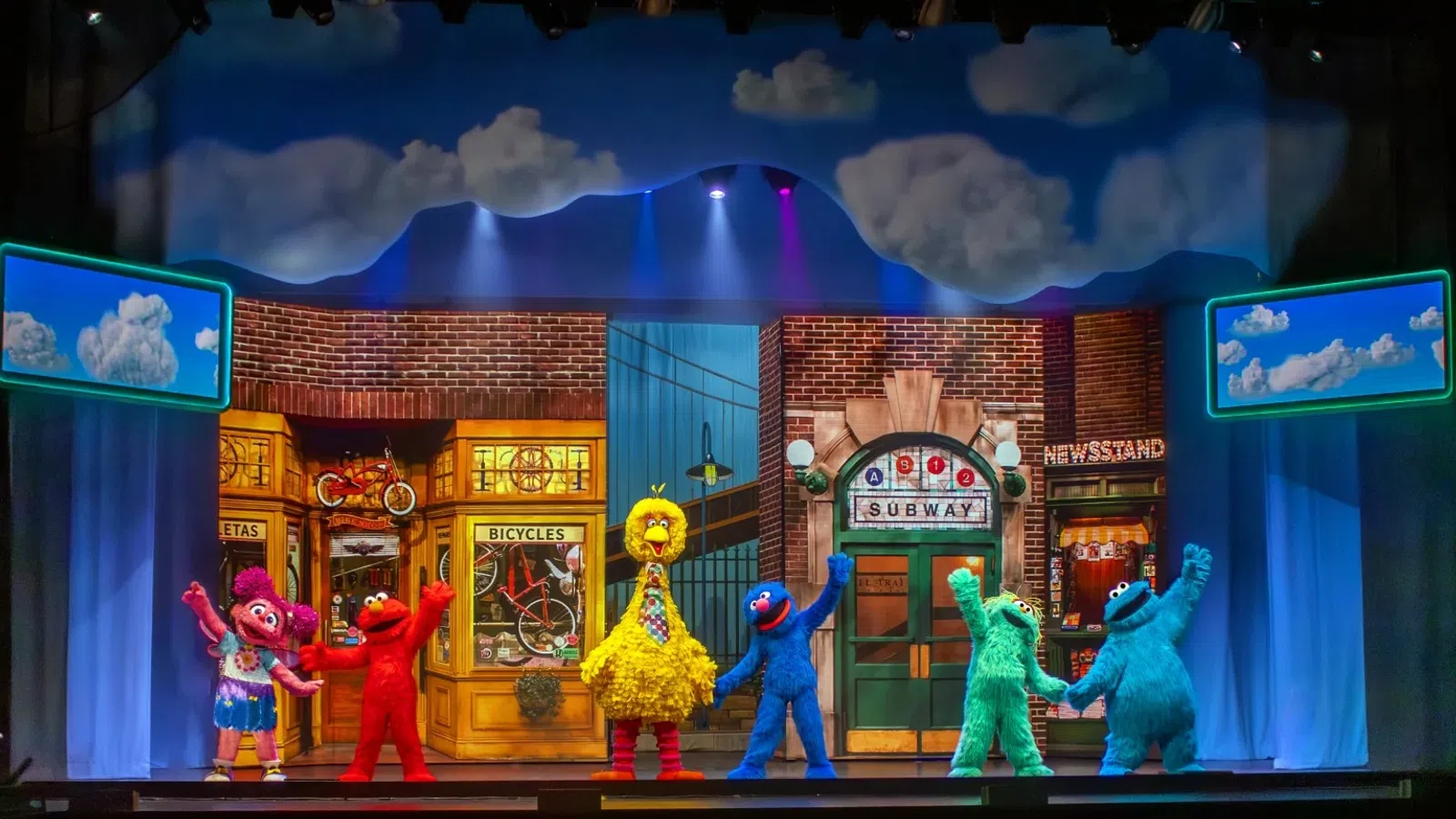 a group of people in clothing on a stage