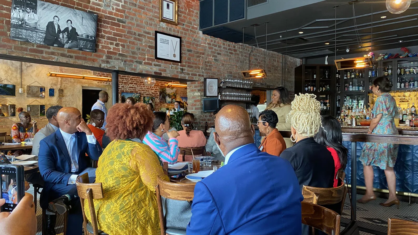 a group of people sitting at tables