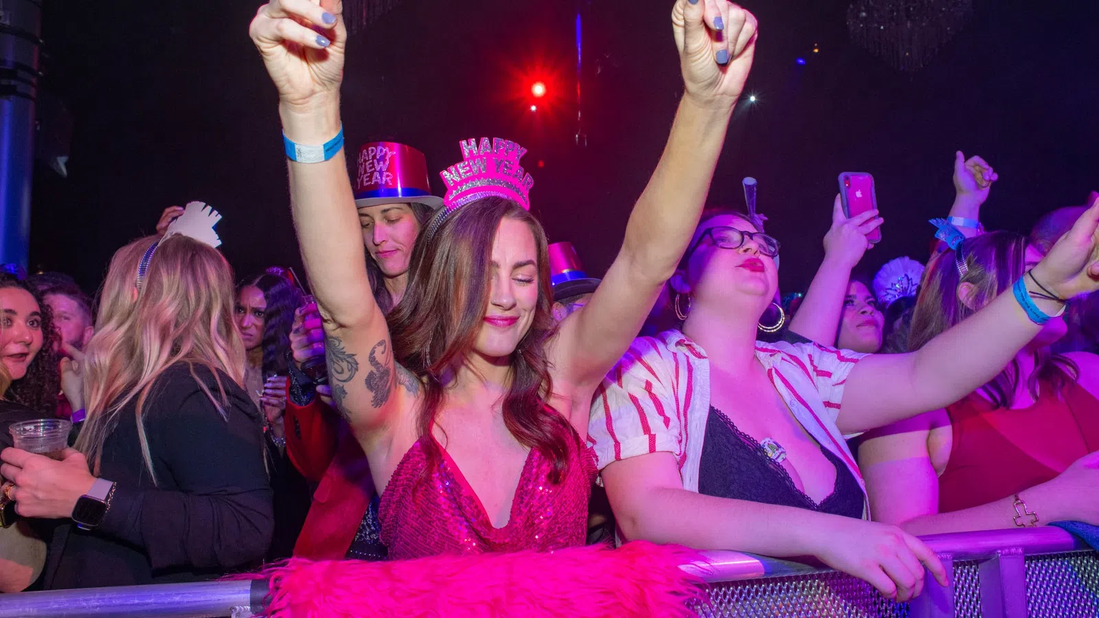 a group of people wearing party hats