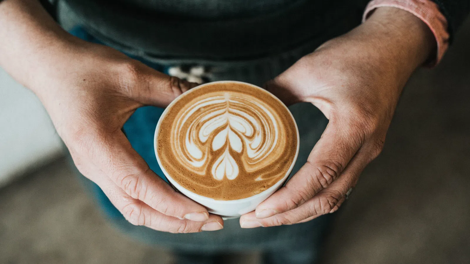 a person holding a cup