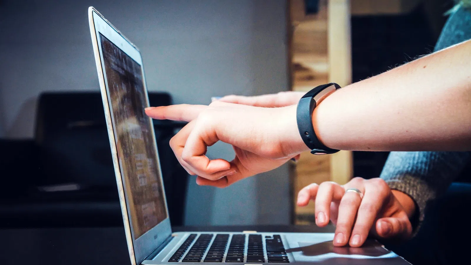 a close-up of hands on a laptop