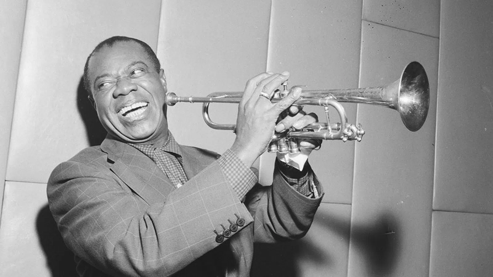 Louis Armstrong playing a trumpet