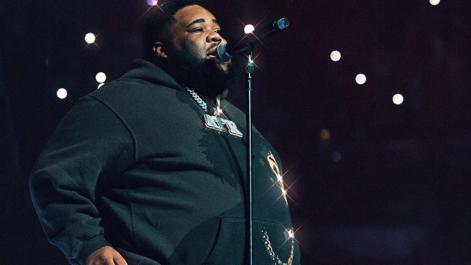 a man singing into a microphone