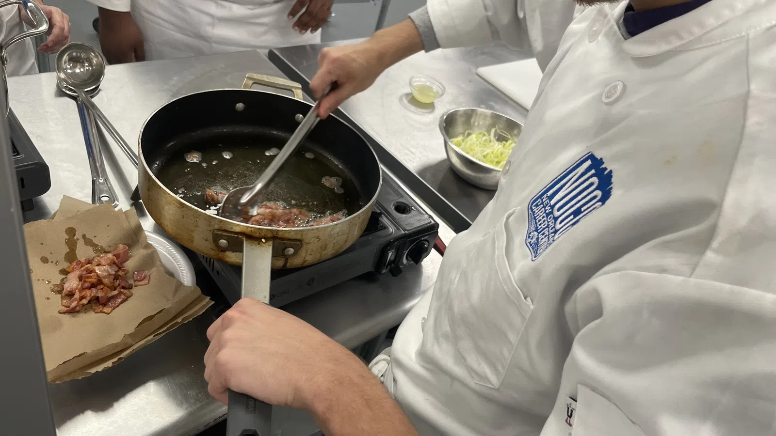 a chef cooking food in a kitchen