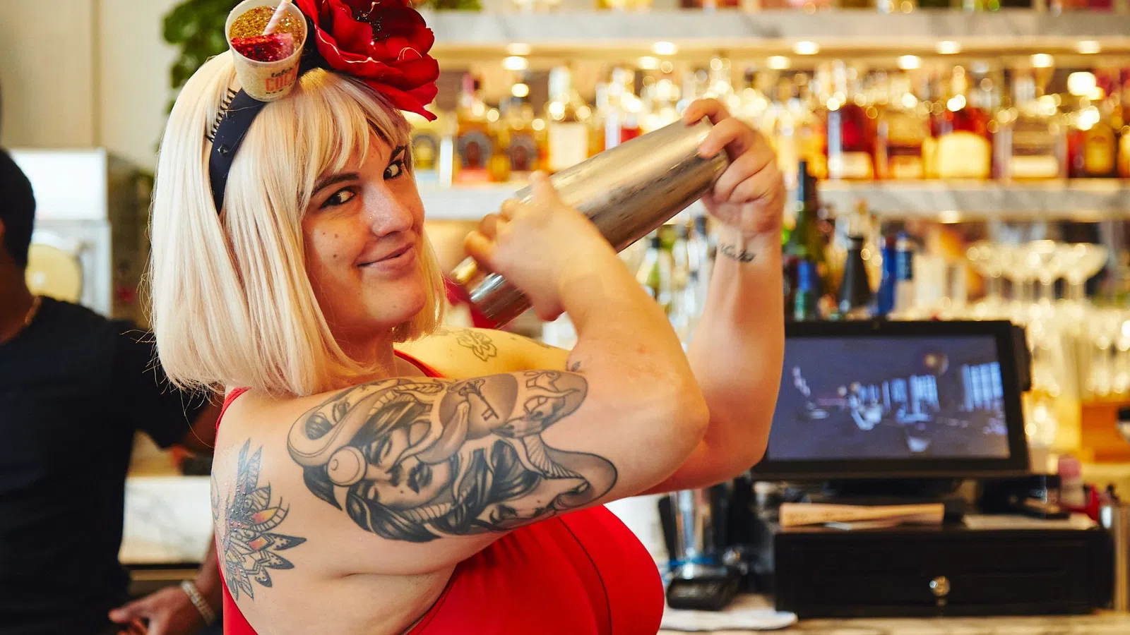 a person holding a bottle of alcohol