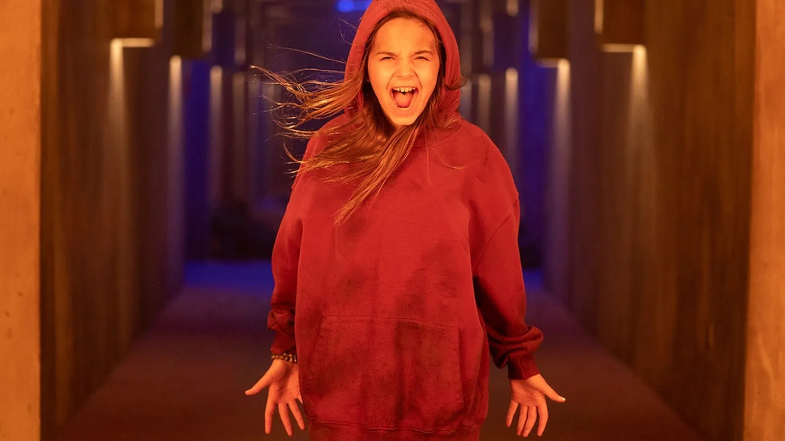 a woman wearing a red hoodie