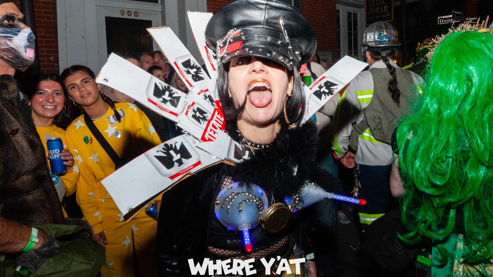 a person wearing a helmet and holding a sign