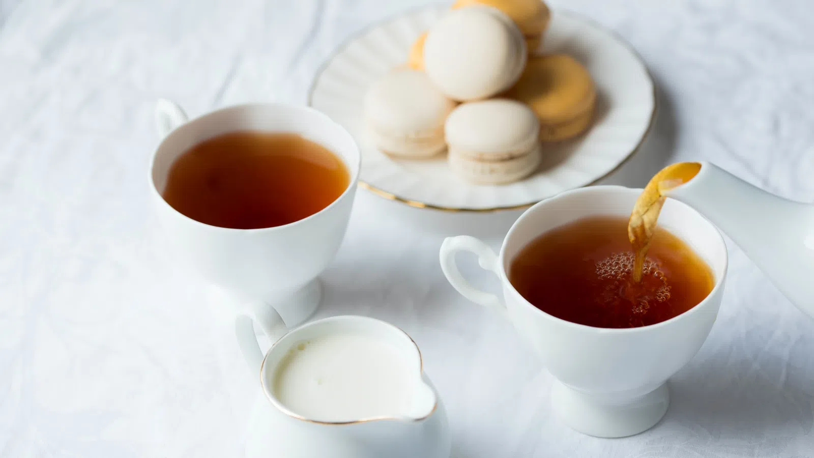a plate of food and a cup of tea