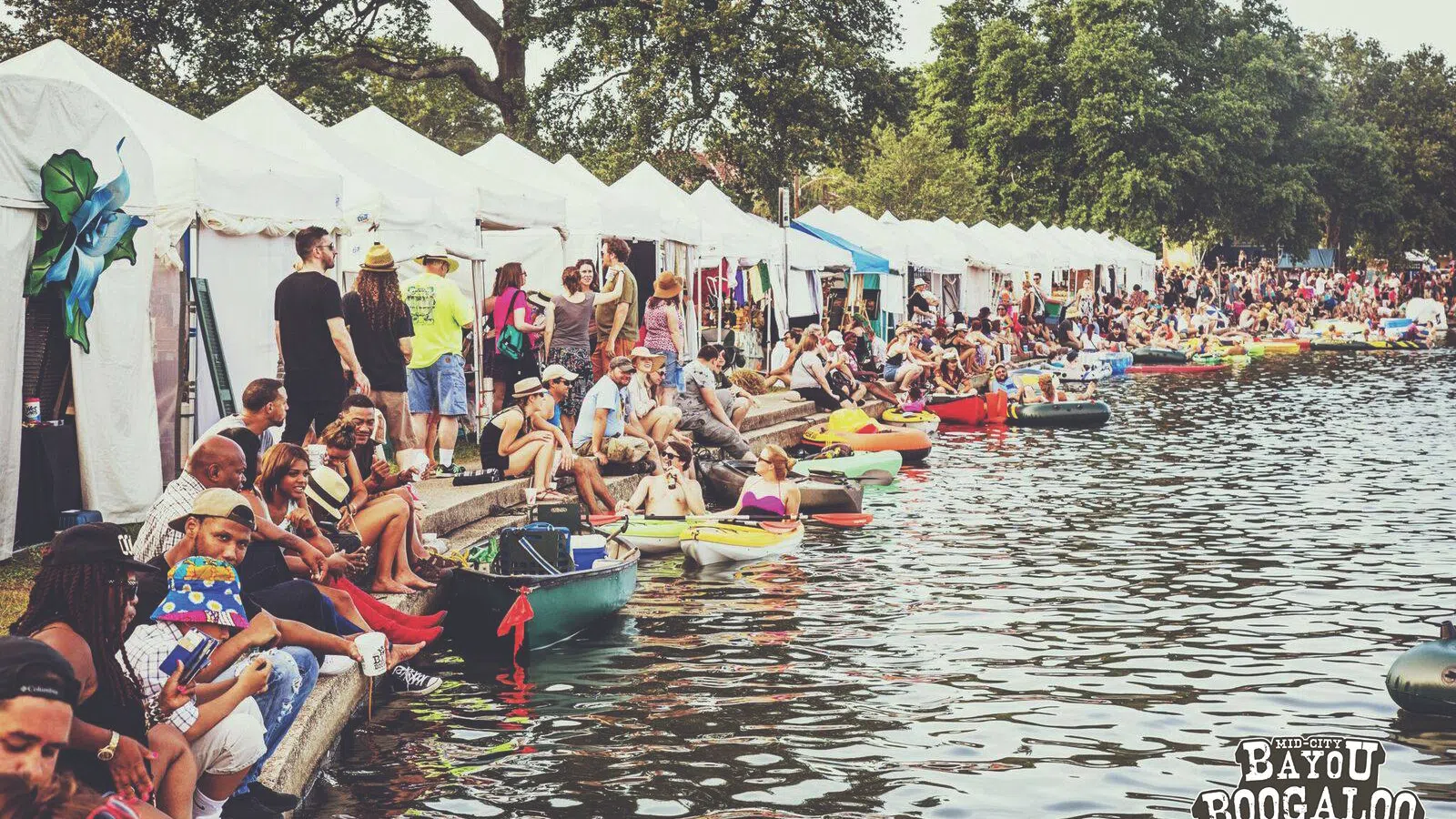 a group of people in canoes on a river