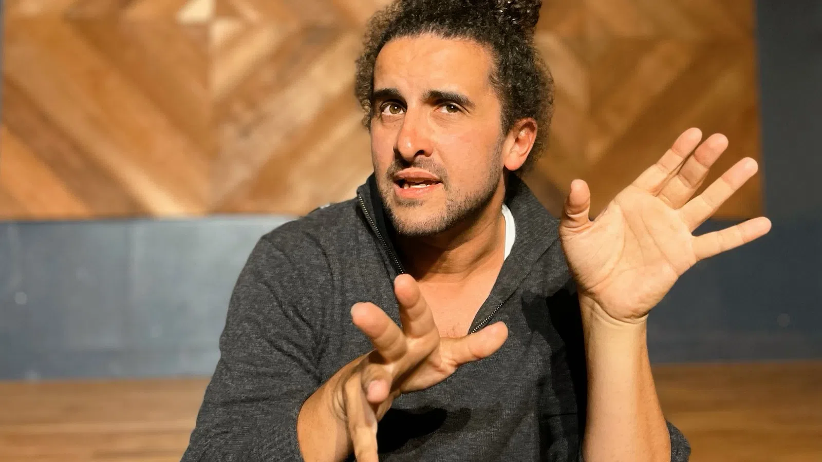 a man with his hands up
