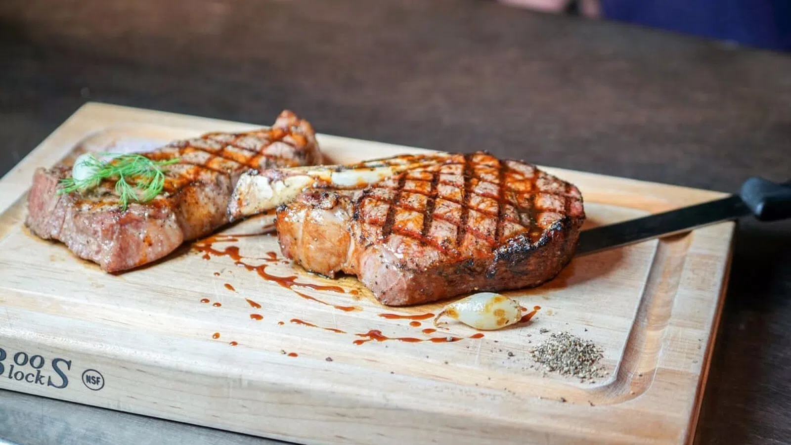 a couple pieces of meat on a cutting board