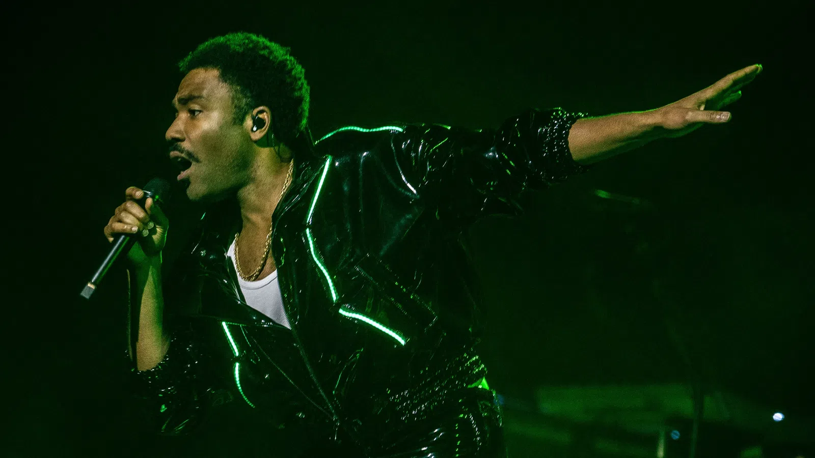 a man singing into a microphone