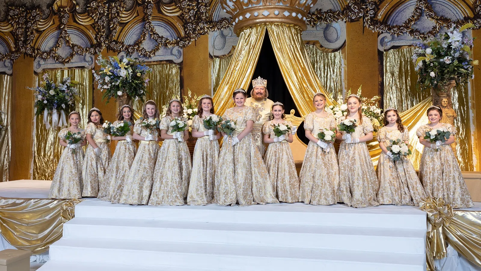 a group of women in white dresses