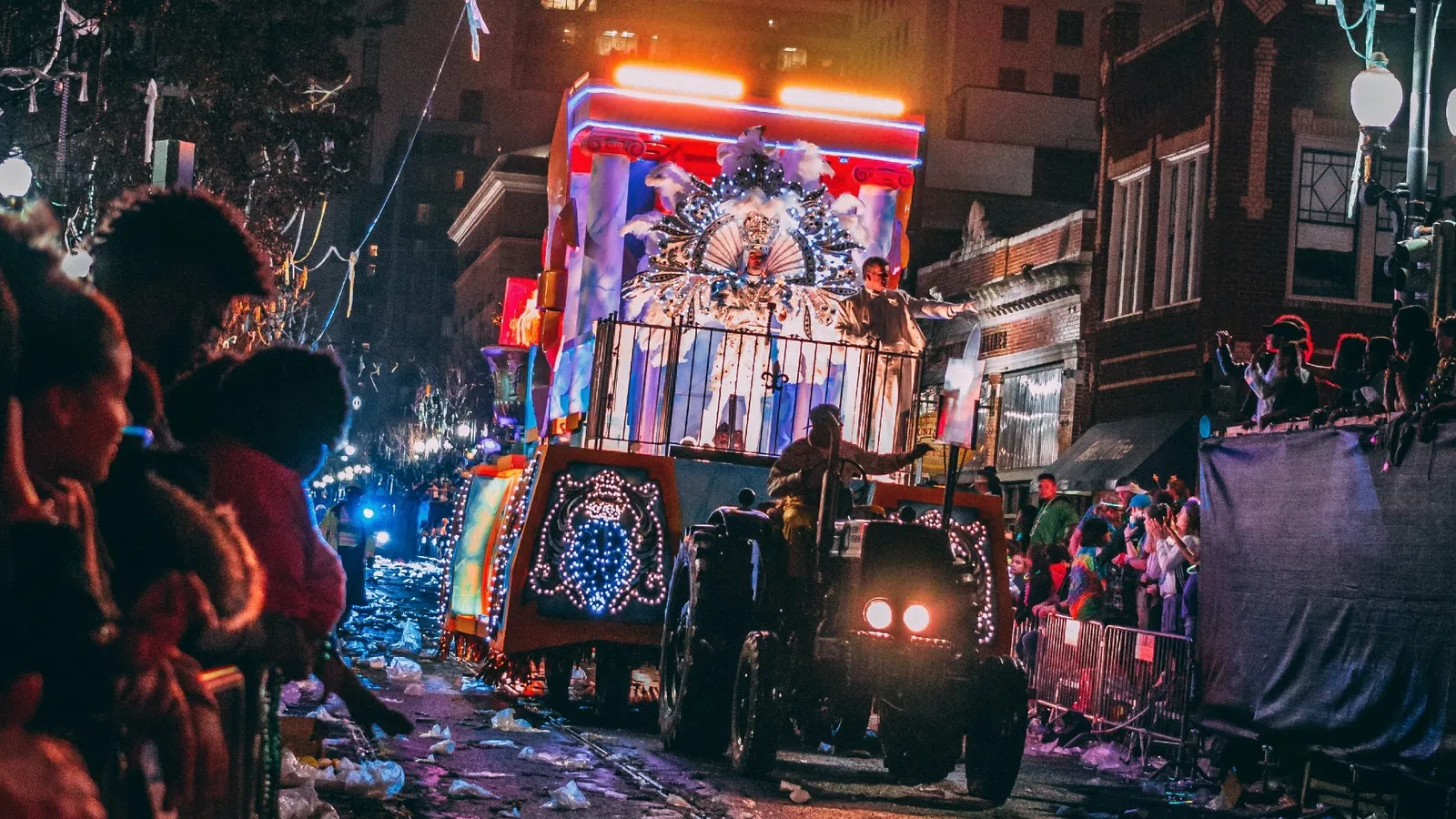 a parade with a horse carriage