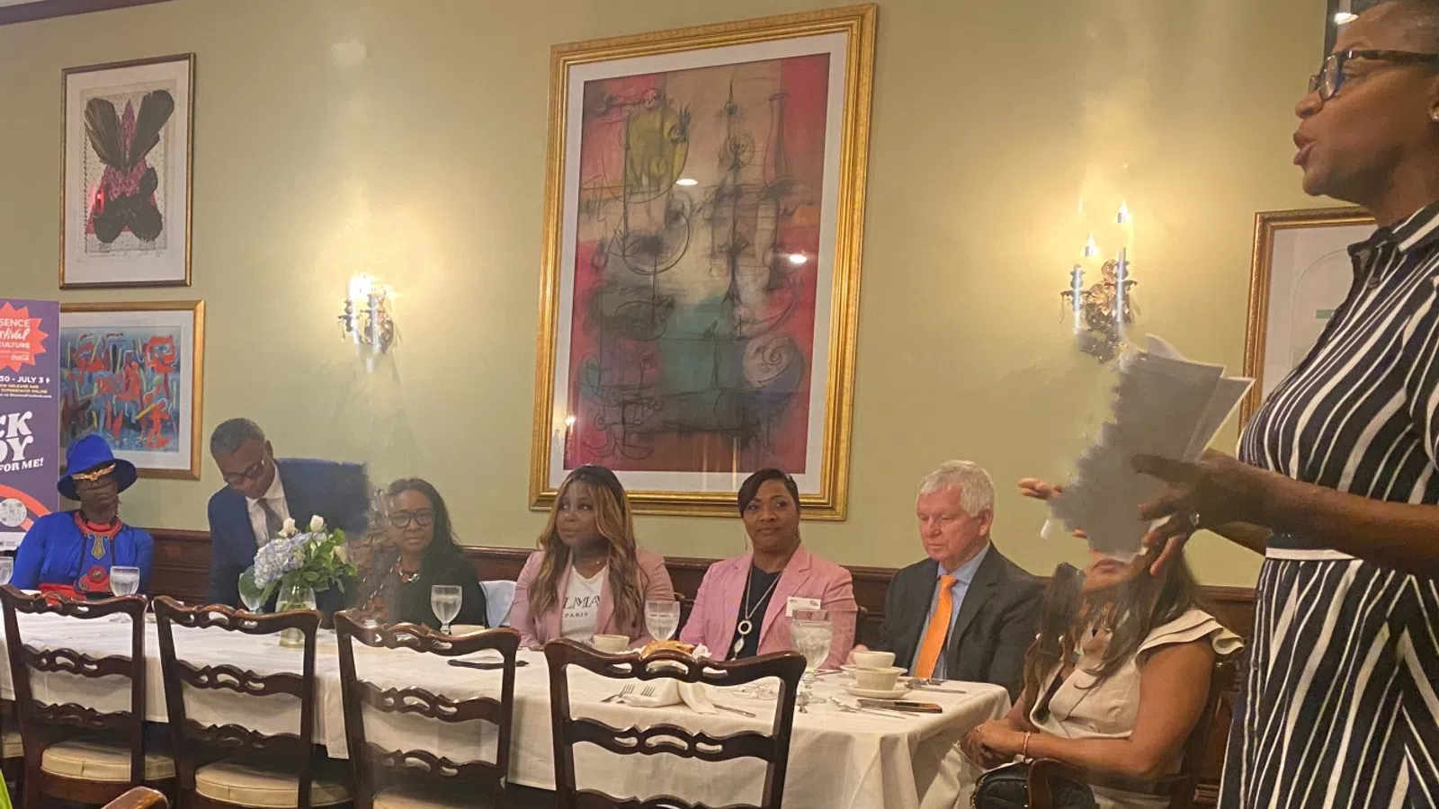 a group of people sitting around a table