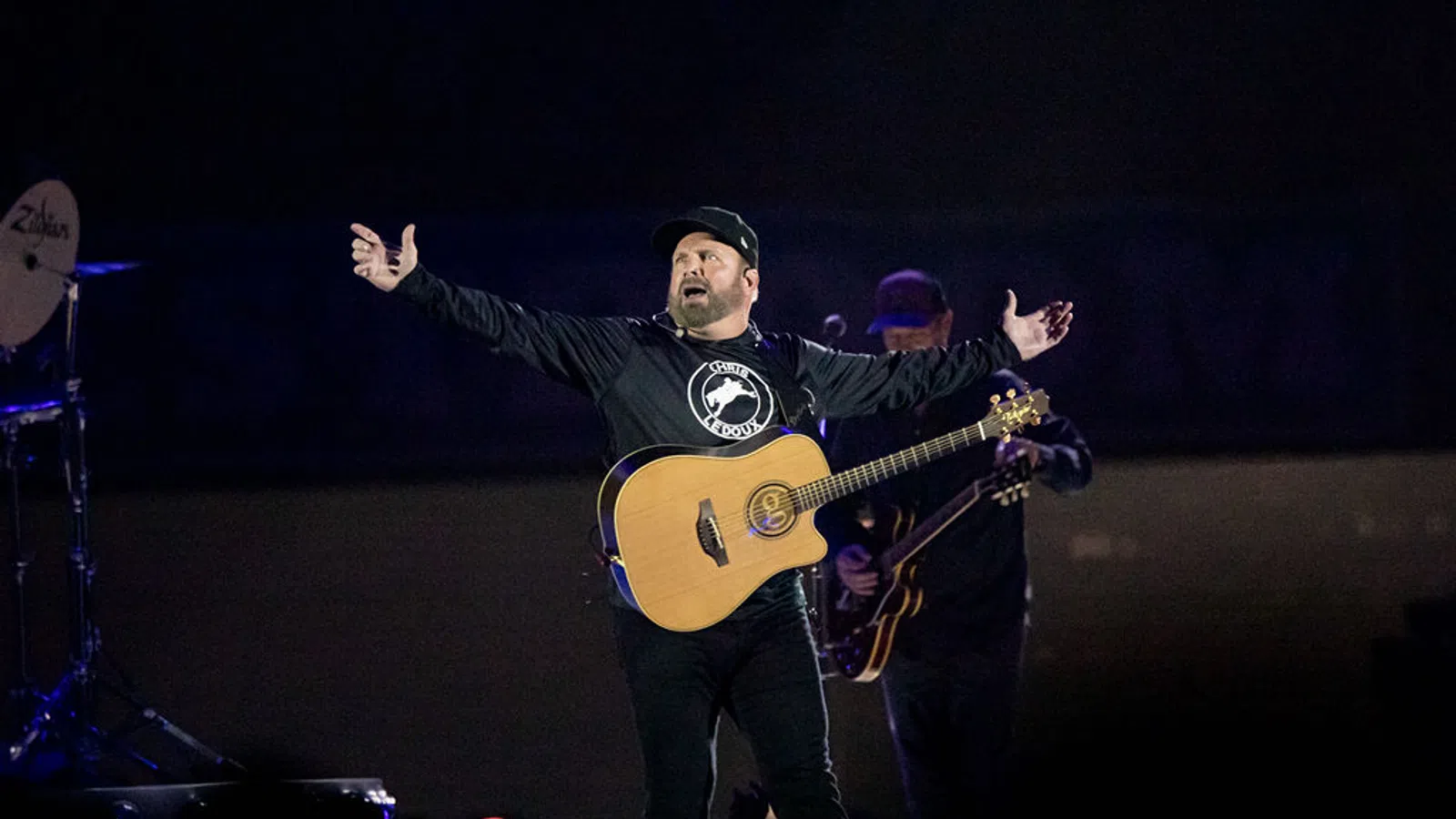 a man holding a guitar