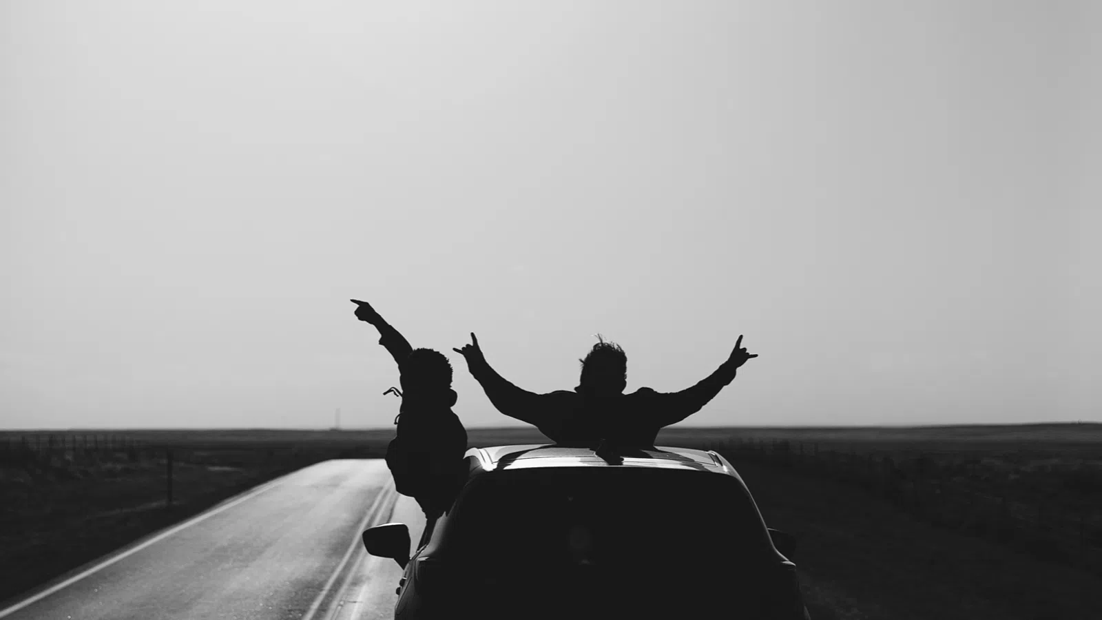a couple of people on a car