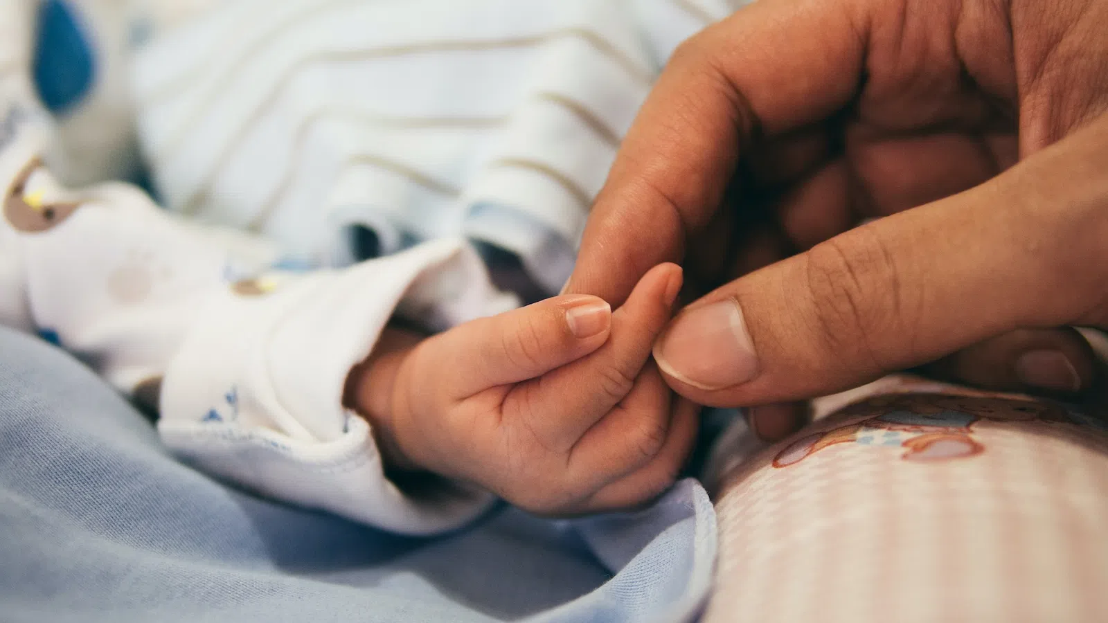 a person holding a baby