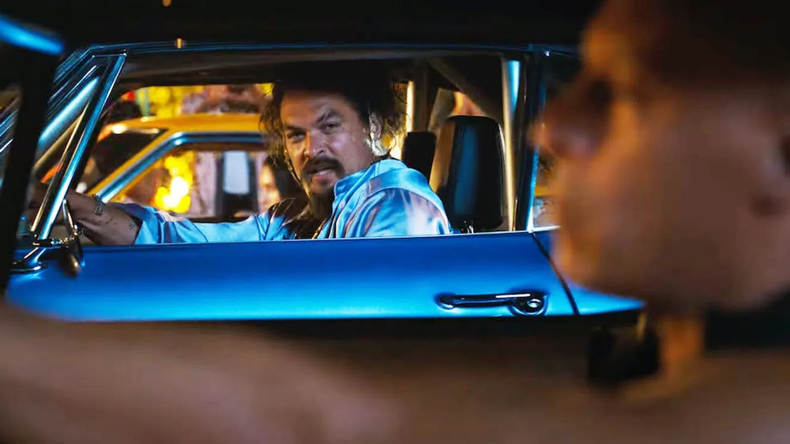 a man driving a car