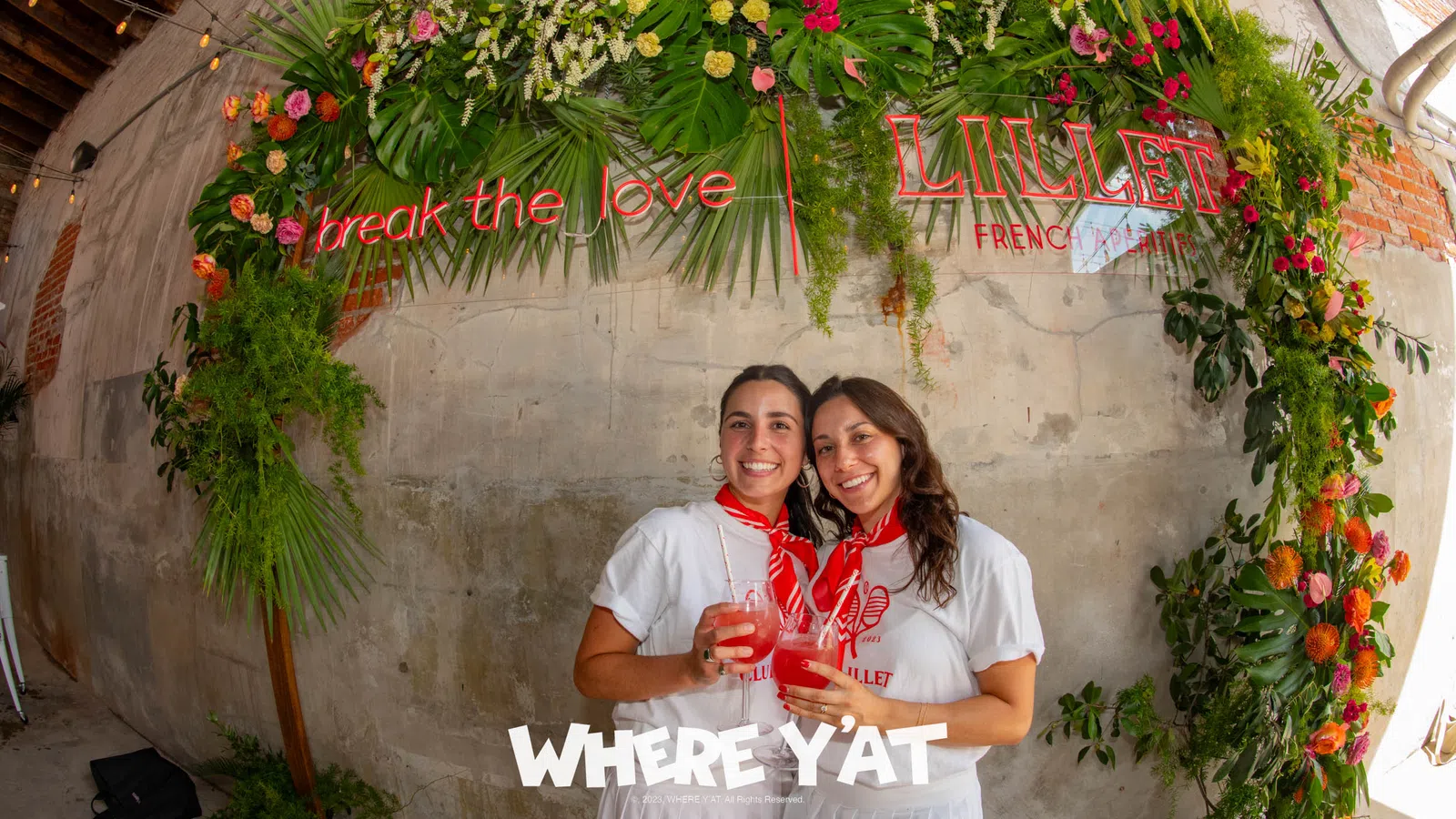 a man and woman holding wine glasses