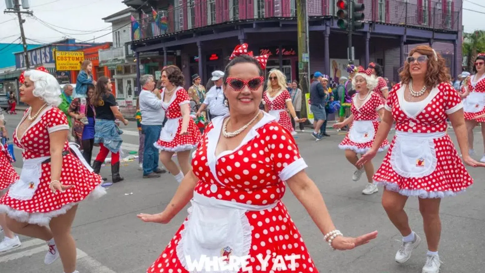 a group of people dancing in a parade