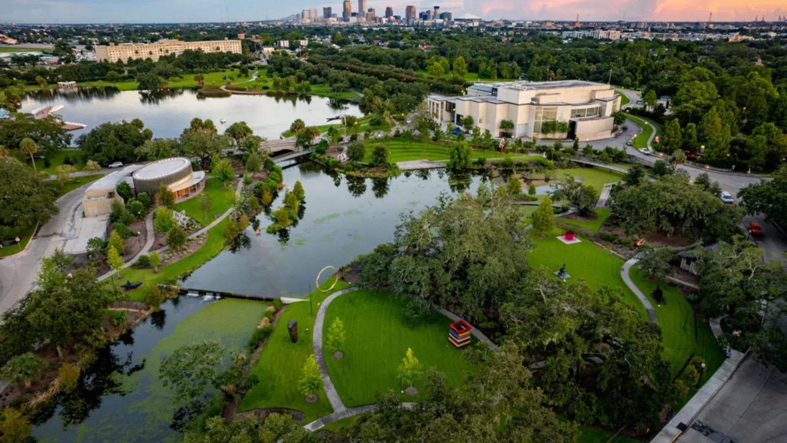 a river with a park and buildings