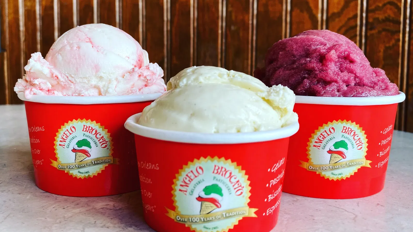 a group of red cups with ice cream in them