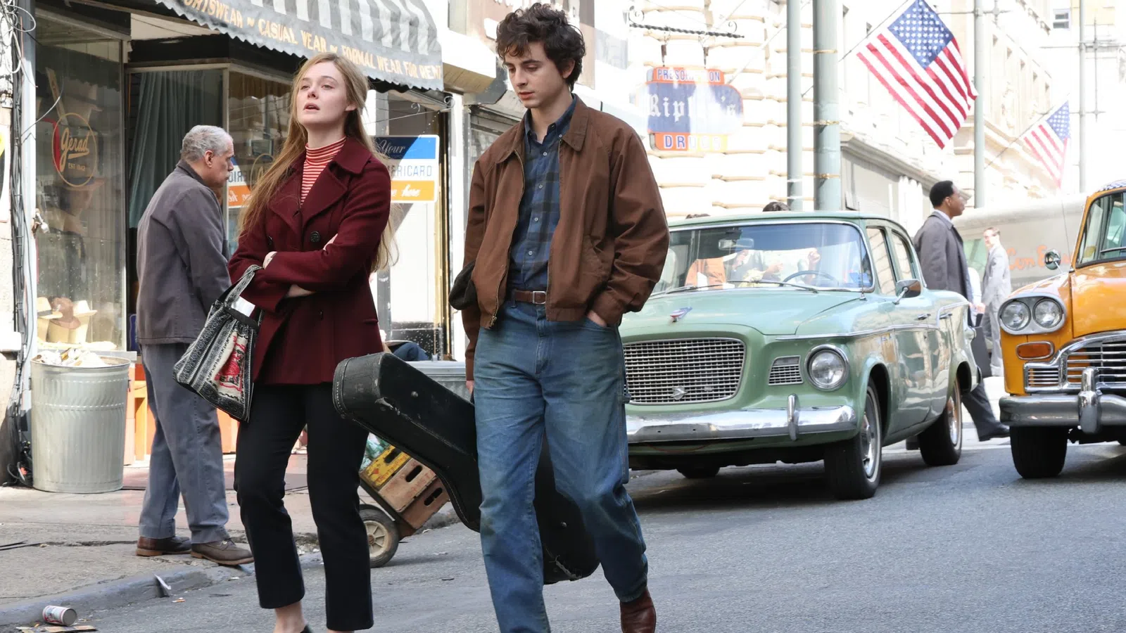 a man and woman walking down the street