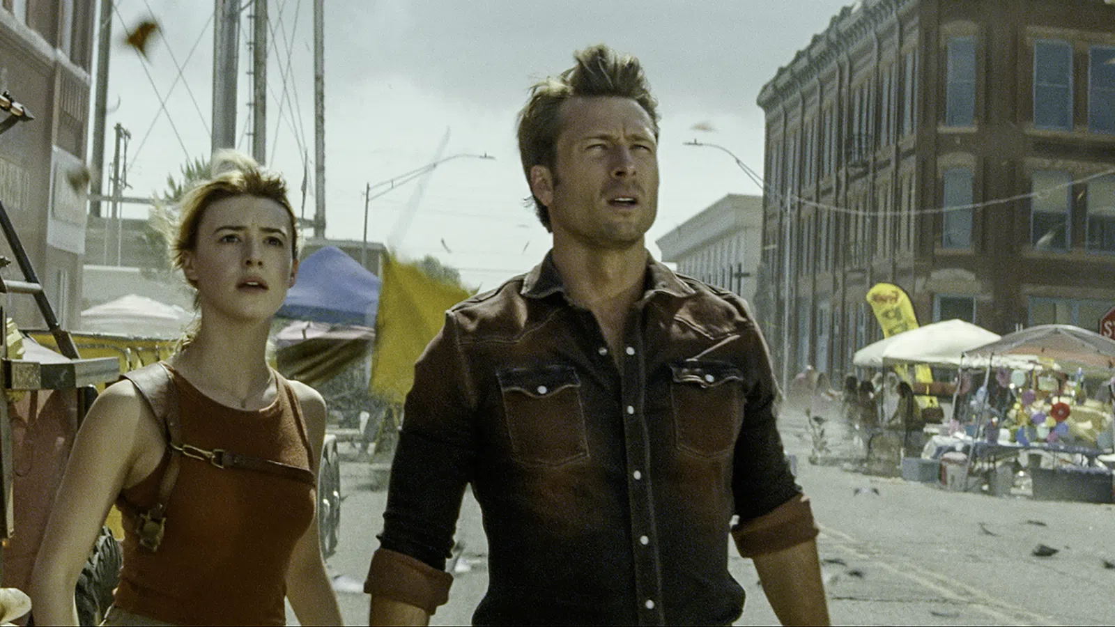 Glen Powell et al. walking on a street