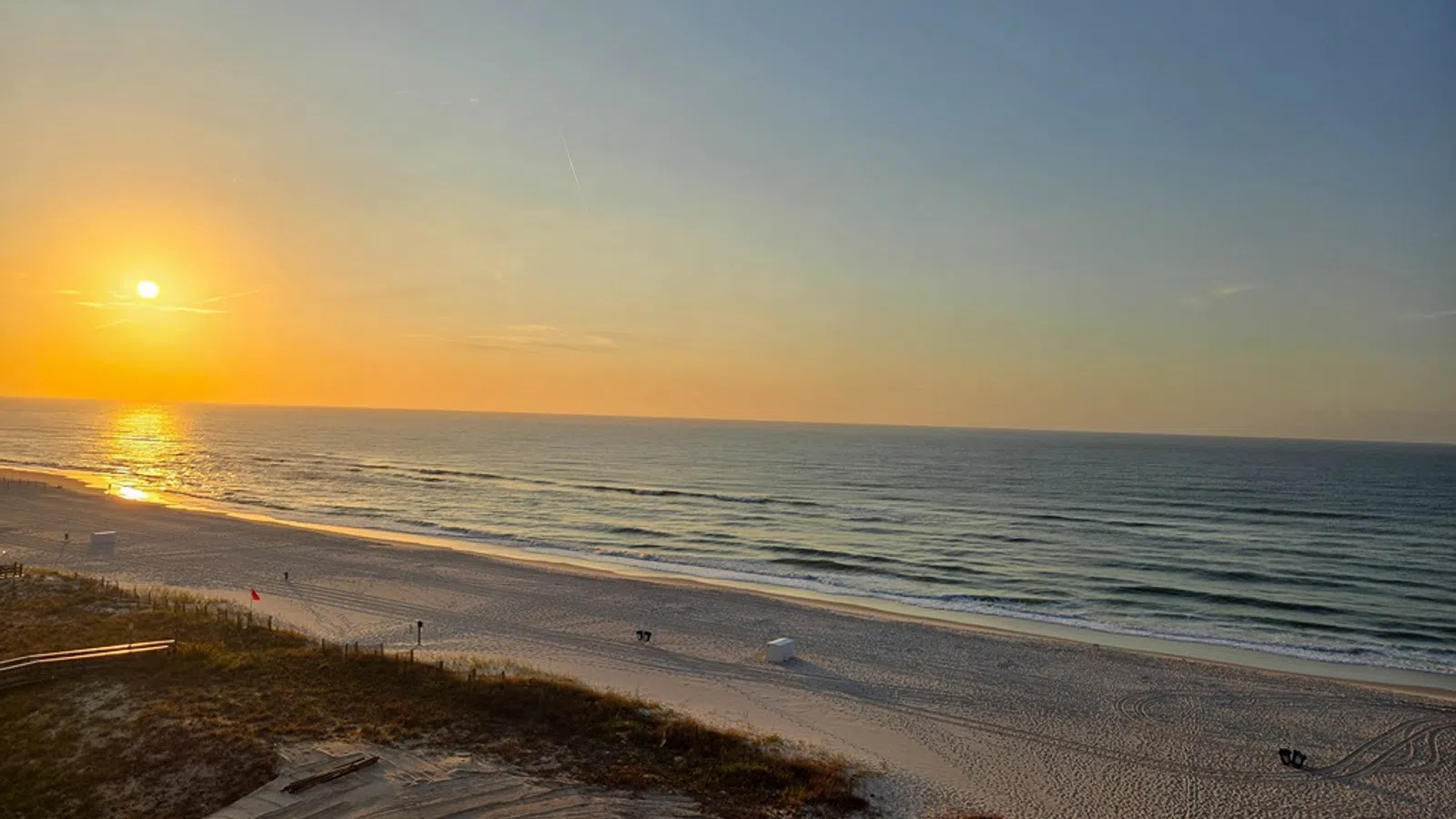 a beach with a sunset